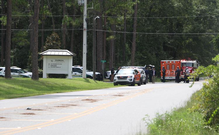 First responders congregate on the Florida Gateway College campus Wednesday afternoon after a bomb threat was called in against the school. (MORGAN MCMULLEN/Lake City Reporter)