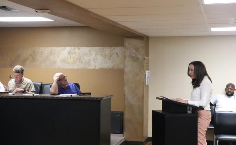 Dr. Molly White (right) gives her presentation to the LSHA board during Wednesday's meeting. (MORGAN MCMULLEN/Lake City Reporter)