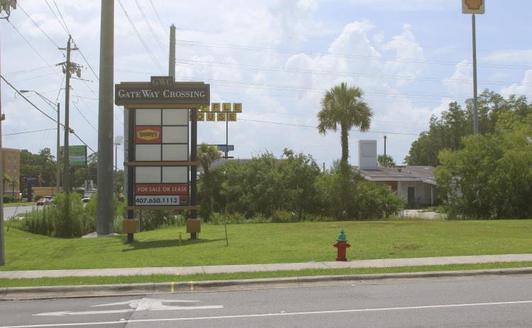 A sign for Gateway Crossing sits at the intersection of NW Centurion Court and U.S. 90, near the proposed sites of Sonic Drive-In and RibCrib restaurants. (JAMIE WACHTER/Lake City Reporter)