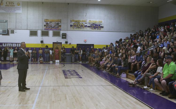 Columbia High School Principal Trey Hosford speaks to a packed gym full of incoming freshmen students and their parents during orientation on Monday. (TONY BRITT/Lake City Reporter)