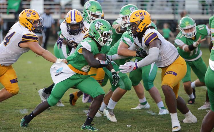 Columbia High defensive lineman Rashod Bradley closes in on Suwannee High running back Marquavious Owens during the Preseason Classic on Aug. 19. (BRENT KUYKENDALL/Lake City Reporter)