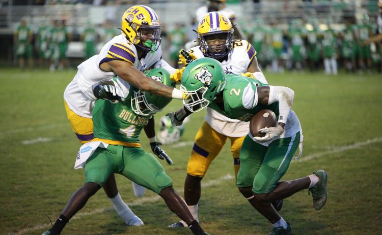 Columbia safety Amare Ferrell (top left) and cornerback Kani Fulton (top right) go in to tackle Suwannee kick returner Jay Smith during last Friday’s Preseason Classic. (BRENT KUYKENDALL/Lake City Reporter)