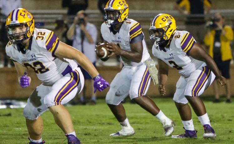 Columbia quarterback Tyler Jefferson (1) takes the snap alongside running back Tony Fulton (2) while fullback Colton Williams (32) heads up the field to block. (BRENT KUYKENDALL/Lake City Reporter)