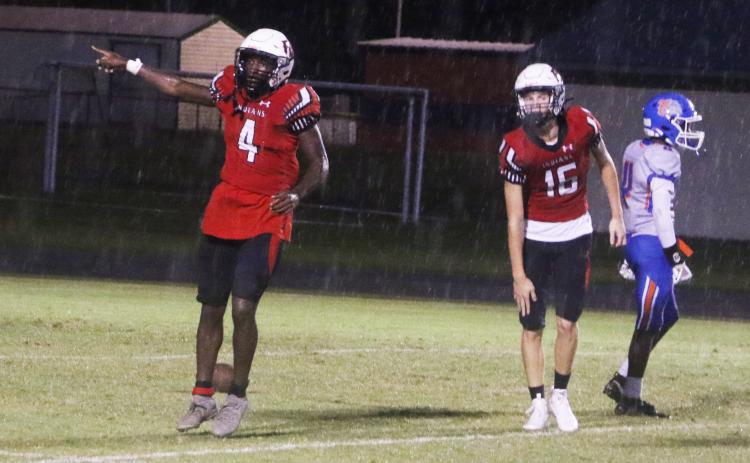 Fort White running back Maliki Clark signals a first down after a long run against Taylor County last Friday. (MORGAN MCMULLEN/Lake City Reporter)
