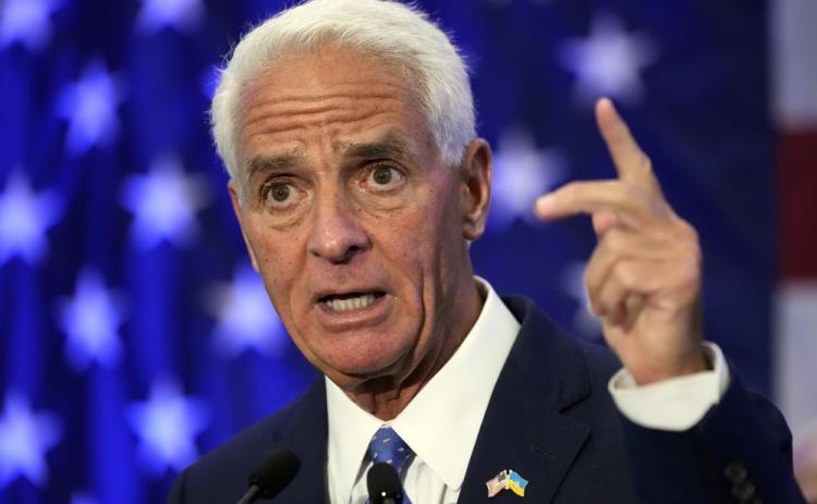 Rep Charlie Crist, D-Fla., gestures after declaring victory Tuesday in St. Petersburg. Crist defeated Agriculture Commissioner Nikki Fried in the Democratic gubernatorial primary election and will face incumbent Republican Gov. Ron DeSantis in November. (CHRIS O'MEARA/Associated Press)