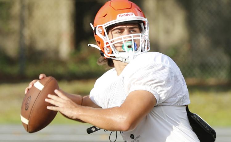 Branford quarterback Cohen David drops back to throw a pass during Friday’s practice. (JAMIE WACHTER/Lake City Reporter)
