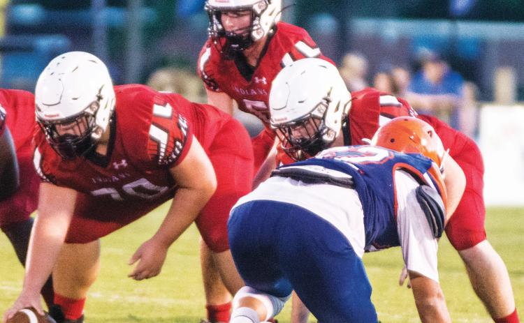 Fort White quarterback Clayton Philpot gets set to take a snap during last Friday’s Preseason Classic against Branford. (CHRISTINA FEAGIN/Special to the Reporter)