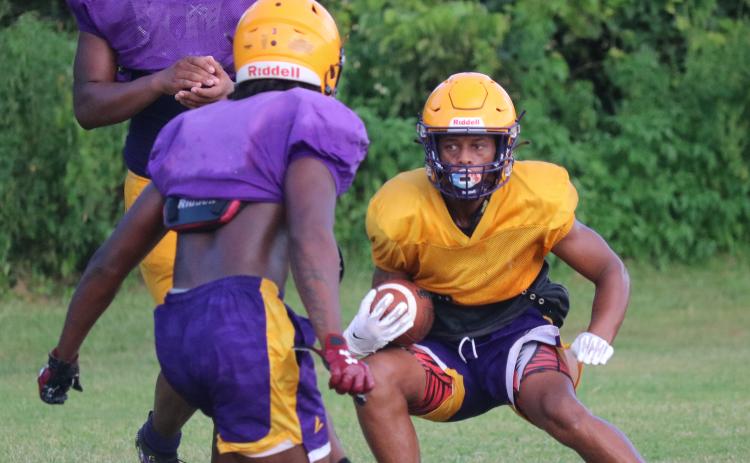 Columbia receiver Dailyn Bradley makes a move in the open field after catching a pass during Friday’s practice. (JORDAN KROEGER/Lake City Reporter)