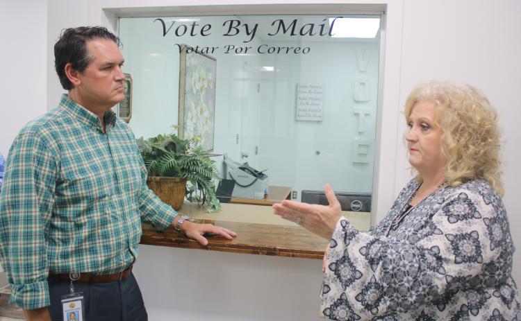 Columbia County Supervisor of Elections Tomi Brown (right) talks with Florida Secretary of State Cord Byrd Monday afternoon. (TONY BRITT/Lake City Reporter)