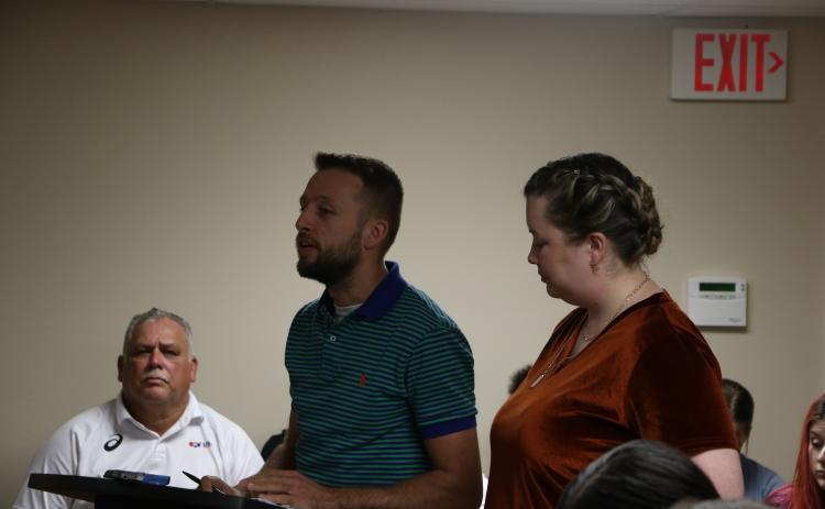 Garrett Morrison, left, and Destiny Evans discussed Remnant Ministries’ vision for the main Lake Shore Hospital building. (MORGAN MCMULLEN/Lake City Reporter)