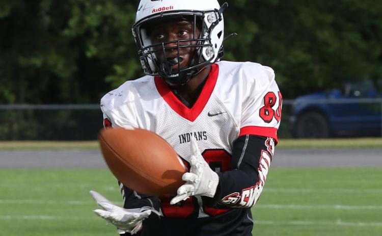 Fort White running back Kamarion Griffin catches a touchdown pass during Friday’s team scrimmage. (MORGAN MCMULLEN/Lake City Reporter)