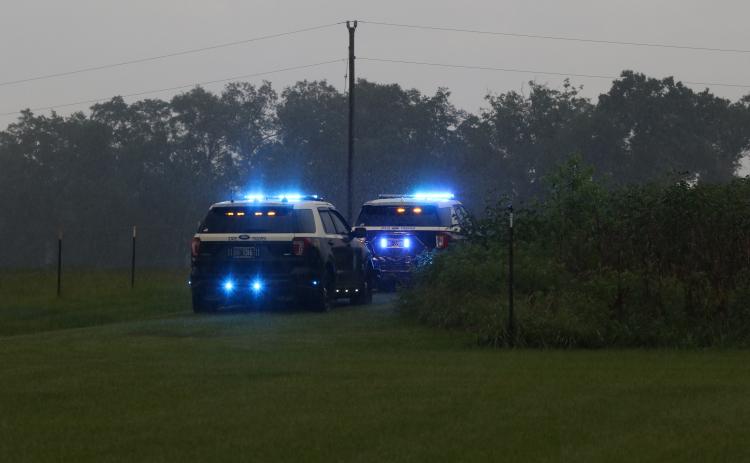 A pair of Florida Highway Patrol vehicles are parked during a search in the King Road and Dyal Avenue area Wednesday afternoon. (MORGAN MCMULLEN/Lake City Reporter)