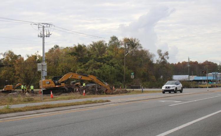 A construction crew works on digging ground for a new roundabout near Bascom Norris Drive back in November. (FILE)