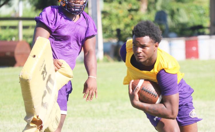 Columbia receiver Tray Tolliver runs after making a catch during Tuesday’s practice. (JORDAN KROEGER/Lake City Reporter)