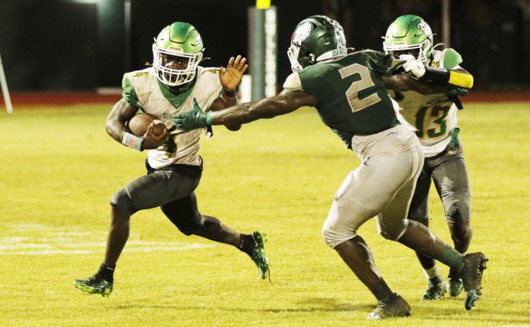 Suwannee running back Marquavious Owens tries to escape a tackle against Flagler Palm Coast last Friday. (JAMIE WACHTER/Lake City Reporter)
