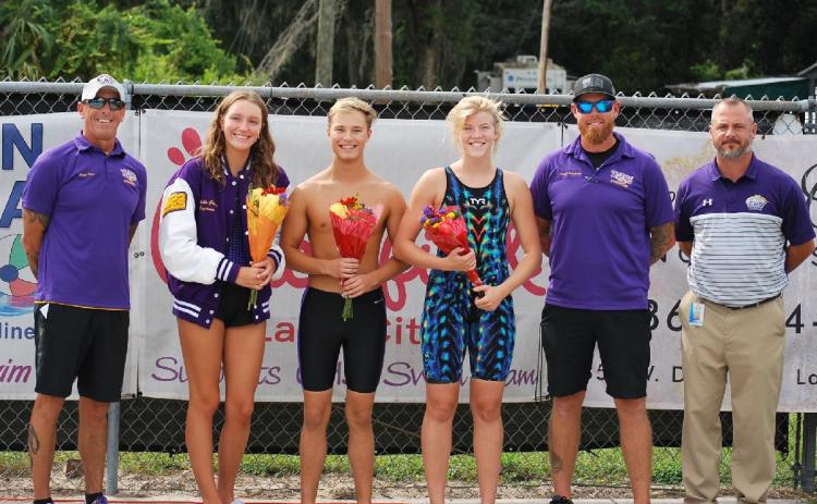 Columbia’s swim team held Senior Night on Tuesday. Pictured are head coach Shawn Rost (from left), Izzy Glenn, Seth Grubb, Abby Schuler, assistant coach Ryan Shoemaker and Columbia Principal Trey Hosford. (COURTESY)