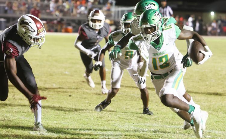 Suwannee defensive back PJ Davis scores on a pick-6 in the third quarter Friday against North Marion. (PAUL BUCHANAN/Special to the Reporter)