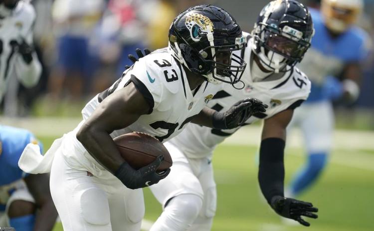 Jacksonville Jaguars linebacker Devin Lloyd runs after intercepting a pass against the Los Angeles Chargers on Sunday in Inglewood, Calif. (MARCIO JOSE SANCHEZ/Associated Press)