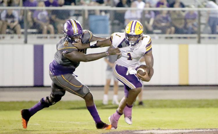 Columbia quarterback Tyler Jefferson, trying to avoid a Union County defender last Friday, will try to deliver the Tigers their first win of the season Friday when Deland visits. (BRENT KUYKENDALL/Lake City Reporter)