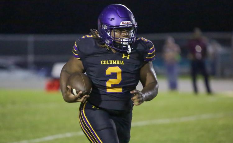 Columbia running back Tony Fulton rushes up the field against Madison County on Friday. (BRENT KUYKENDALL/Lake City Reporter)