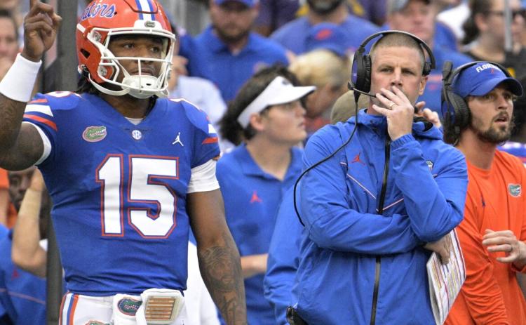 Florida coach Billy Napier, front right, and quarterback Anthony Richardson (15) watch from the sideline during the first half of the team's Week 1 game against Utah. (PHELAN M. EBENHACK/Associated Press)