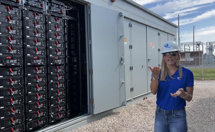 Stevany Cole, a project developer with Florida Power & Light, speaks about the battery storage technology utilized at the Echo River Solar Energy Center in Suwannee County on Thursday. (JAMIE WACHTER/Lake City Reporter)