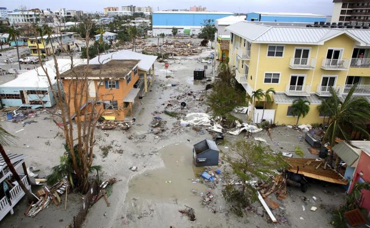 Damaged homes and businesses are seen in Fort Myers Beach on Thursday following Hurricane Ian. (DOUGLAS R. CLIFFORD/Tampa Bay Times via AP)