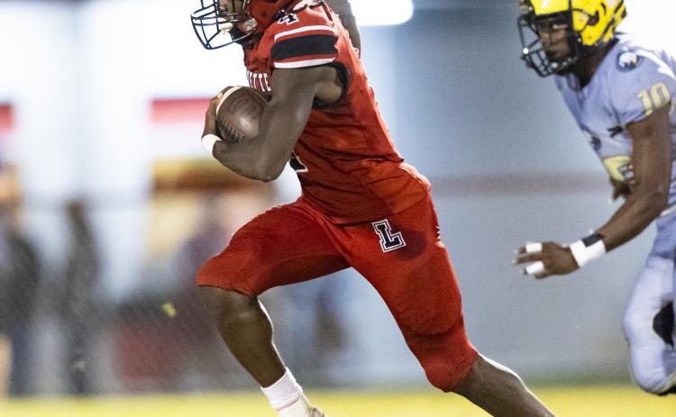 Lafayette running back Kiami McKnight pulls away from a Zarephath Academy defender on a touchdown run Friday night at Dale Walker Field. (JACK HOWDESHELL/Special to the Reporter)