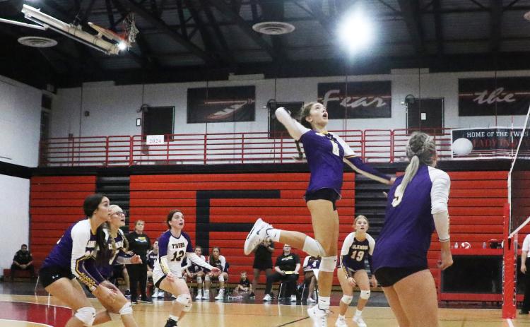 Columbia’s Sinei Wood rises to slam a shot against Fort White on Thursday. (MORGAN MCMULLEN/Lake City Reporter)
