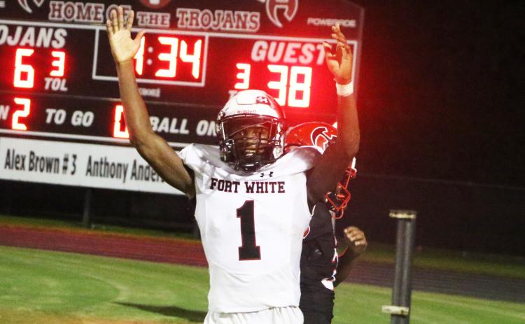 Fort White fullback Maliki Clark celebrates after scoring a touchdown against Hamilton County on Friday. (MORGAN MCMULLEN/Lake City Reporter)