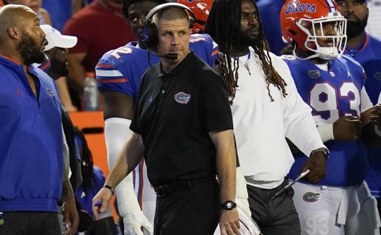 Florida head coach Billy Napier paces the sideline during last Saturday's game against South Florida in Gainesville. (JOHN RAOUX/Associated Press)