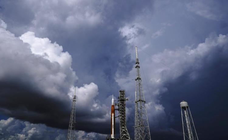 The NASA moon rocket stands on Pad 39B before a launch attempt for the Artemis 1 mission to orbit the moon at the Kennedy Space Center on Sept. 2, 2022, in Cape Canaveral, Fla. NASA mission managers decided Monday, Sept. 26, 2022, to move its moon rocket off the launch pad and into shelter due to Hurricane Ian's uncertain path. (Brynn Anderson/AP File)