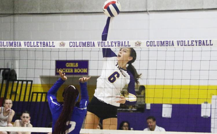 Columbia’s Sinei Wood rises to hit a shot against St. Francis Catholic on Monday. (MORGAN MCMULLEN/Lake City Reporter)