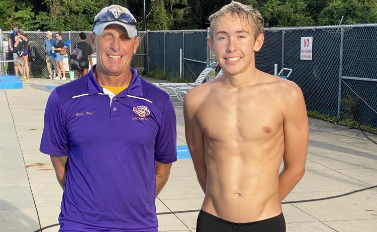 Columbia swimmer Ian Disosway (right) broke the school record in the 100 breaststroke during Thursday’s meet against Baker County. Disosway is pictured with Columbia head coach Shawn Rost. (COURTESY)