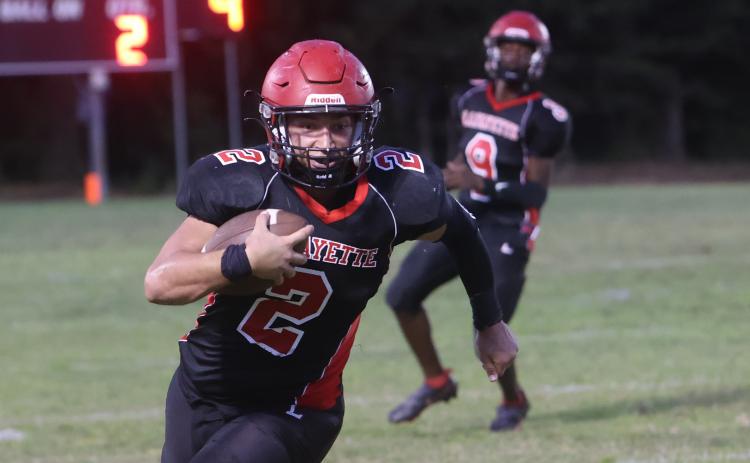 Lafayette tight end Carter Higginbothom runs up the field after a catch against Branford on Monday night. (PAUL BUCHANAN/Special the Reporter)