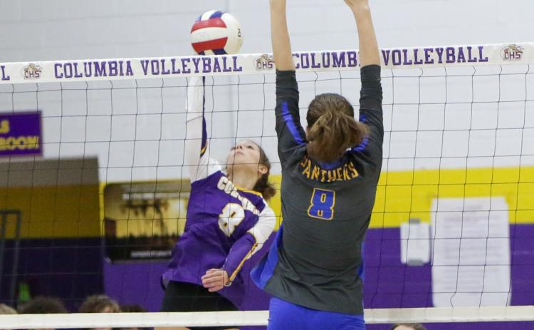Columbia’s Haidyn Markham fires a shot over the net against Newberry on Tuesday night. (BRENT KUYKENDALL/Lake City Reporter)