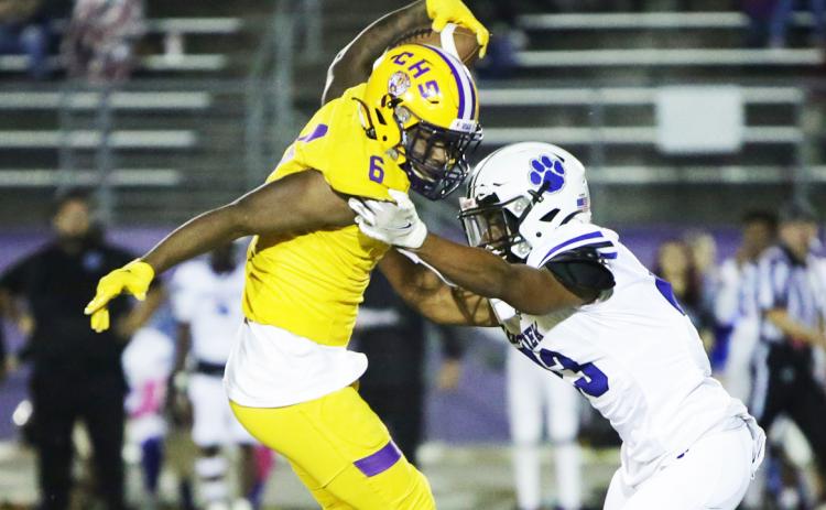 Columbia receiver Tray Tolliver makes a move on a Ridgeview defender after a catch on Friday. (BRENT KUYKENDALL/Lake City Reporter)
