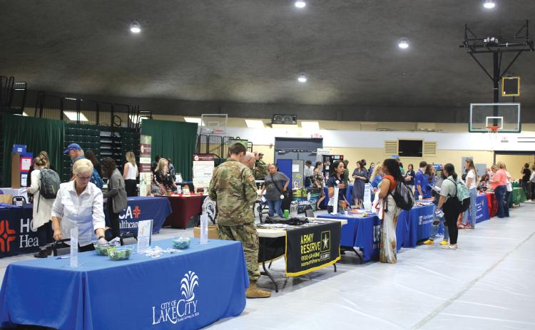 Booths get set up during Florida Gateway College’s career fair back in April. (FILE)