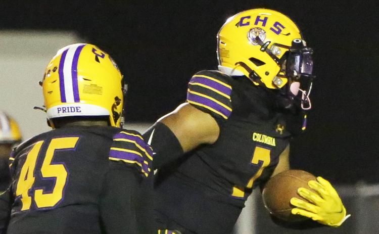 Columbia safety Amare Ferrell returns an interception for a touchdown against Gadsden County on Friday. (BRENT KUYKENDALL/Lake City Reporter)