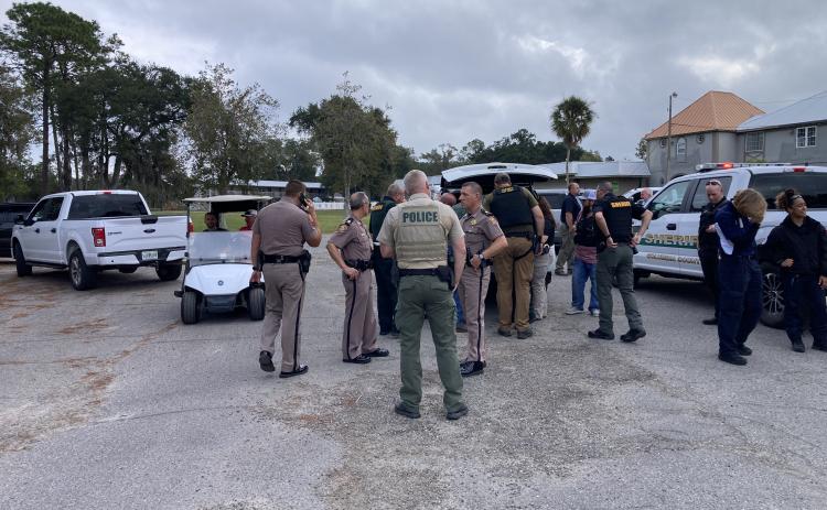 Different law enforcement agencies gather during Friday’s pursuit. (COURTESY)