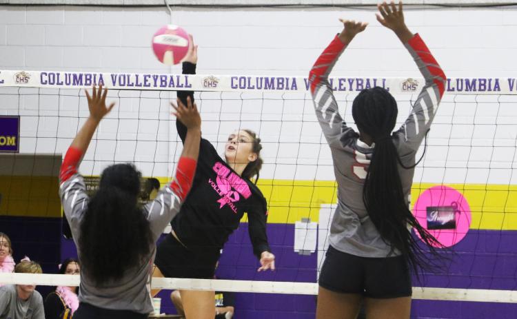 Columbia’s Sinei Wood sends a shot over the net against Bradford on Thursday. (MORGAN MCMULLEN/Lake City Reporter)