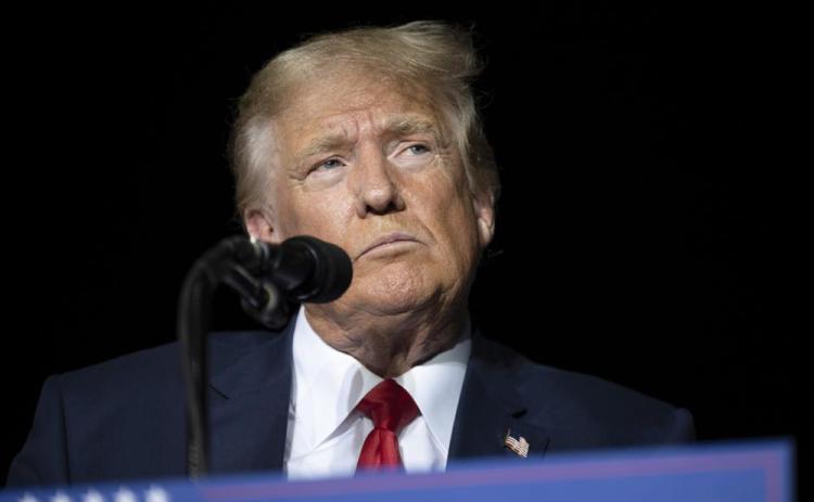 Former President Donald Trump pauses while speaking at a rally Oct. 8 in Minden, Nev. (AP FILE)