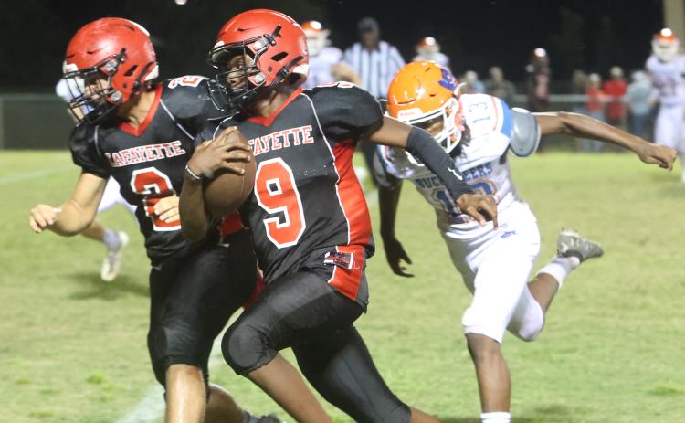 Lafayette quarterback Tywan Williamson rushes for a touchdown against Branford on Monday night. (PAUL BUCHANAN/Special to the Reporter)
