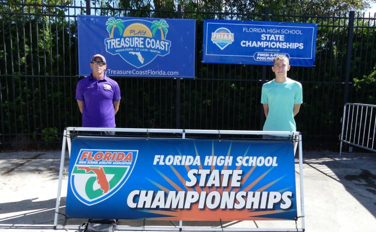 Columbia head coach Shawn Rost (left) and swimmer Ian Disosway (right) at the Class 3A state meet on Friday. (COURTESY)