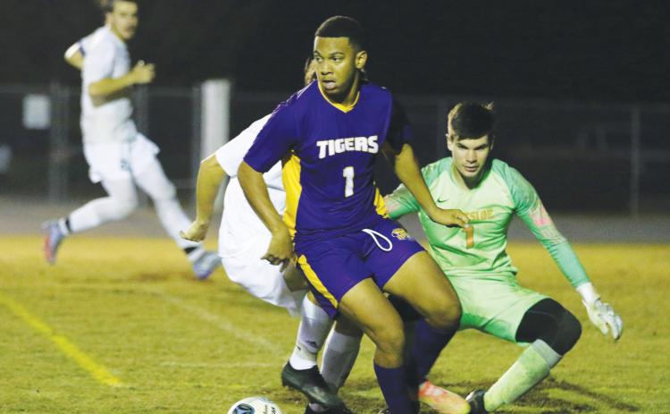 Columbia’s AJ Brinson looks to pass against Eastside last season. (FILE)