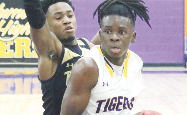 Columbia guard Isaac Broxey drives to the basket against Buchholz on Jan. 18. (JORDAN KROEGER/Lake City Reporter)