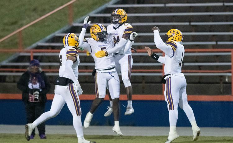 Columbia linebacker Jaden Robinson (5) celebrates with teammates after scoring on a pick-6 against Escambia during the Region 1-3S semifinals on Friday. (GREGG PACHKOWSKI/Pensacola News Journal)