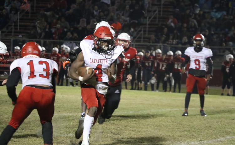 Lafayette running back Kiami McKnight scored on a 20-yard touchdown to give the Hornets the lead Friday. (MORGAN MCMULLEN/Lake City Reporter)