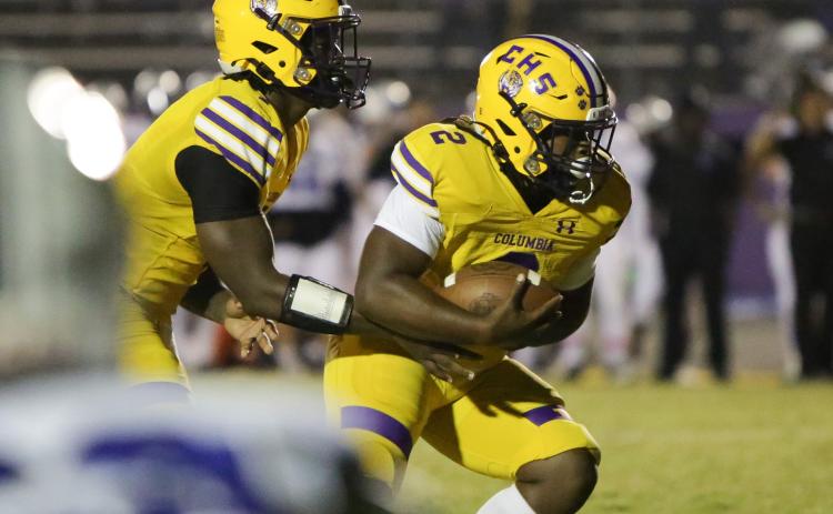 Columbia quarterback Tyler Jefferson hands the ball off to running back Tony Fulton vs. Ridgeview on Oct. 28. (BRENT KUYKENDALL/Lake City Reporter)