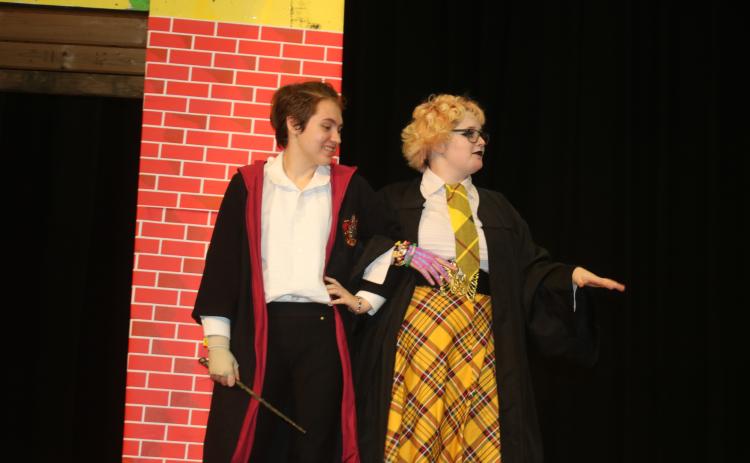 Apollo Davison (from left) and Ash Esposito practice their lines in a dress rehearsal for the production of ‘Puffs’ at Columbia High School. There are three performances scheduled for the weekend. (TONY BRITT/Lake City Reporter)